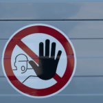 Warning sign with a hand symbol