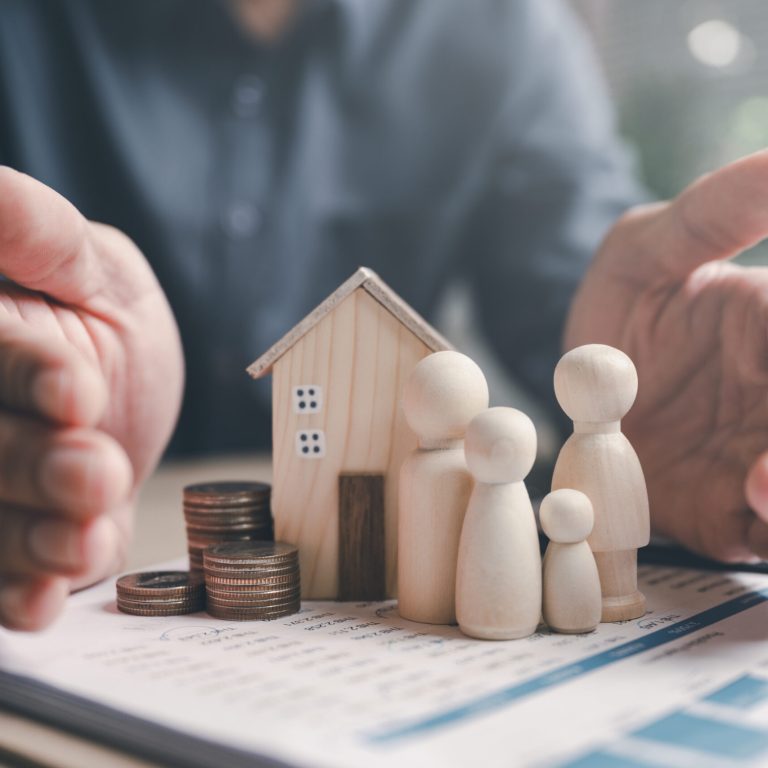 Family insurance plan protect. Help medicine protection. Father mother children insurance. A man is holding a house and family figurines on top of a stack of coins. Concept of financial security.